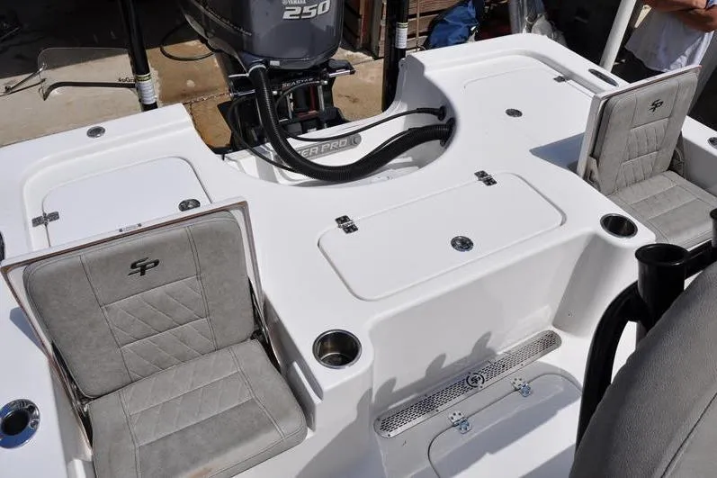 Slide: The Image of 2021 Sea Pro 228 Bay boat interior with seating and Yamaha 250 engine. - 13