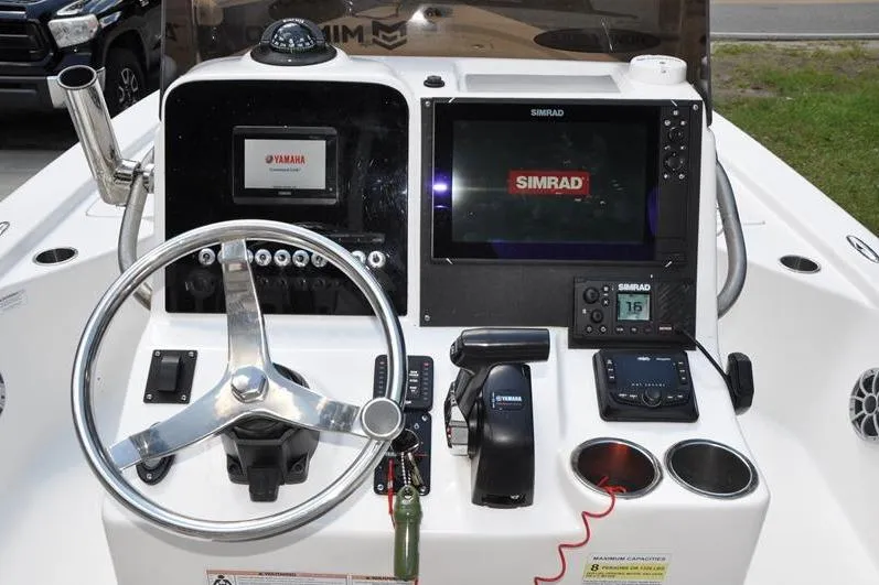 Slide: The Image of 2021 Sea Pro 228 Bay boat dashboard with Simrad electronics and Yamaha controls. - 17