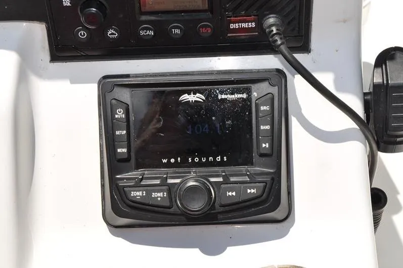 Slide: The Image of Control panel of a 2021 Sea Pro 228 Bay boat featuring Wet Sounds audio system. - 22