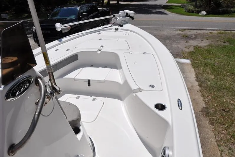 Slide: The Image of 2021 Sea Pro 228 Bay boat with spacious deck and storage compartments. - 24