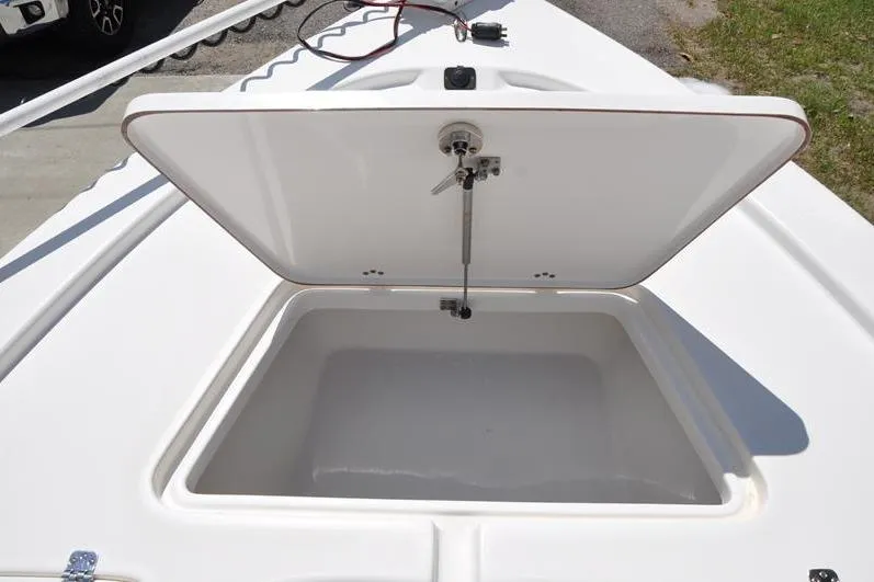 Slide: The Image of Open storage compartment on 2021 Sea Pro 228 Bay boat deck. - 28