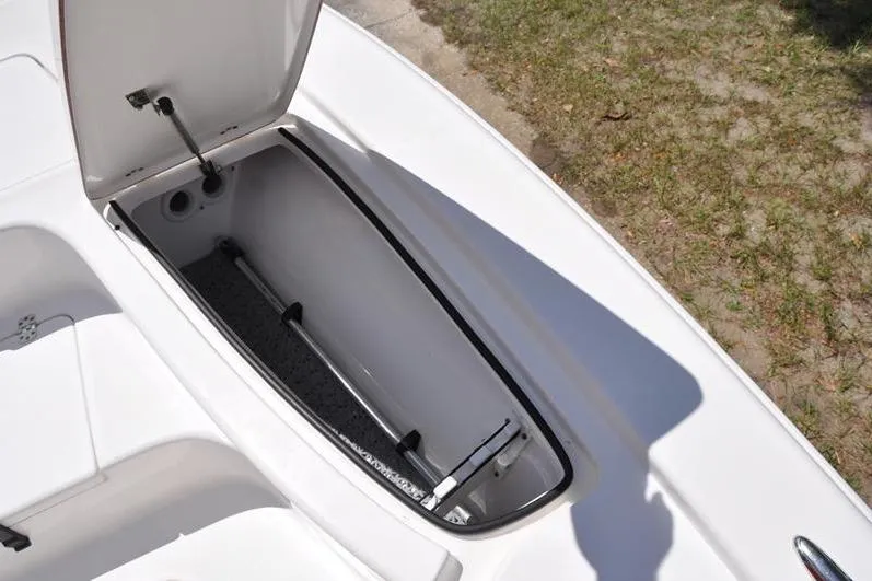 Slide: The Image of Open storage compartment on 2021 Sea Pro 228 Bay boat, showing interior details. - 29