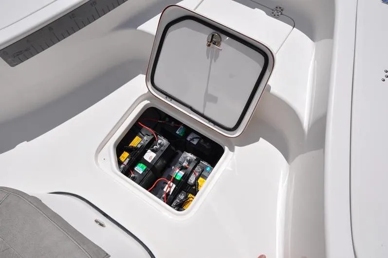 Slide: The Image of 2021 Sea Pro 228 Bay boat battery compartment with open hatch. - 31