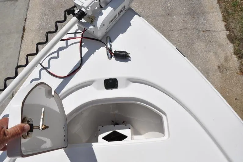 Slide: The Image of 2021 Sea Pro 228 Bay boat bow with open hatch and trolling motor. - 33