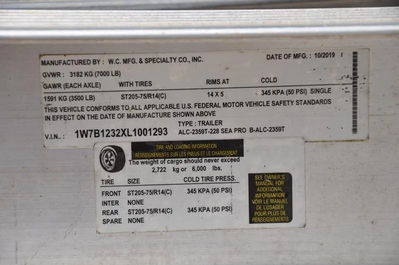 Slide: The Image of Label on a 2021 Sea Pro 228 Bay trailer, detailing tire and load specifications. - 36