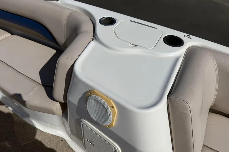 Slide: The Image of Interior of 2013 Hurricane 188 boat with beige seating and built-in speaker. - 14