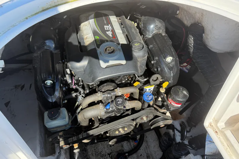 Slide: The Image of Engine compartment of a 2013 Hurricane 188 boat, featuring a 4.3L motor. - 22