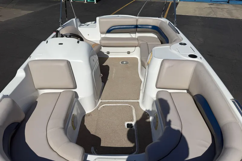 Slide: The Image of Interior of a 2013 Hurricane 188 boat with beige seating and carpeted floor. - 27