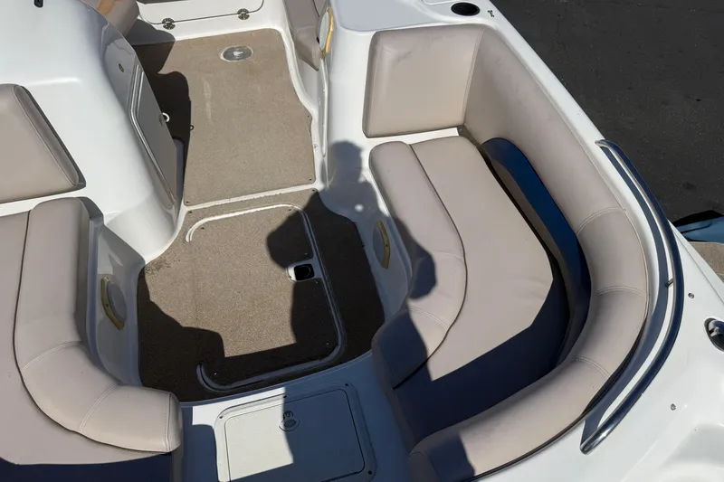 Slide: The Image of Interior of a 2013 Hurricane 188 boat with beige seating and carpeted floor. - 31