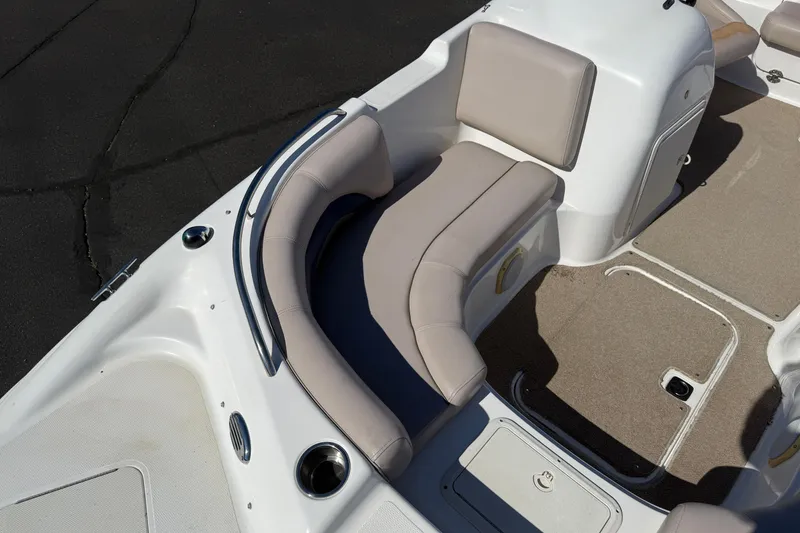 Slide: The Image of Interior seating of 2013 Hurricane 188 boat with beige cushions and carpeted floor. - 9