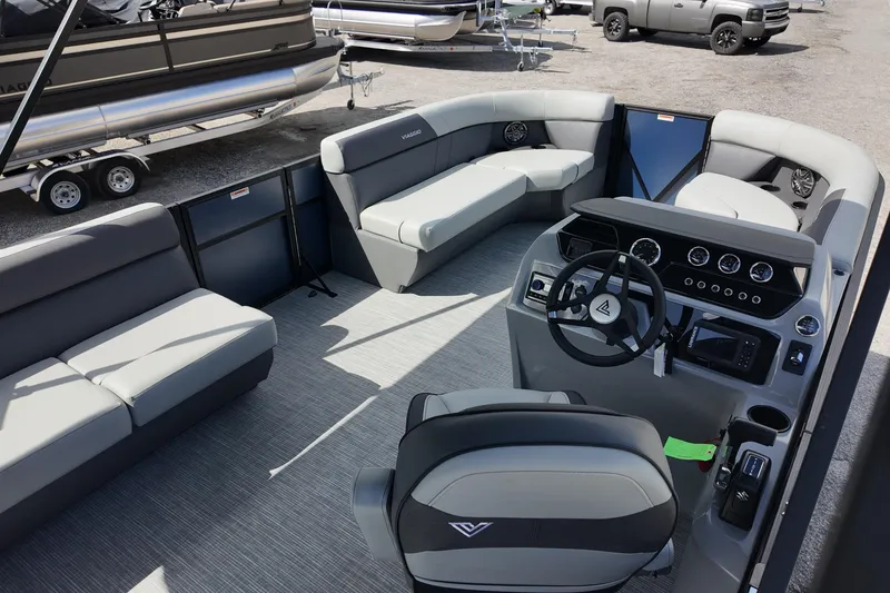 Slide: The Image of 2026 Viaggio Lago V 20 C pontoon boat interior with modern seating and steering console. - 16