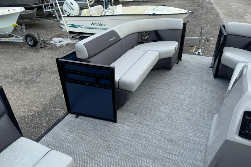 Slide: The Image of 2026 Viaggio Lago V 20 C pontoon boat interior with gray seating and carpeted floor. - 19