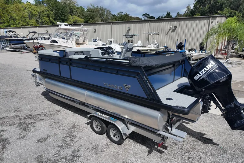 Slide: The Image of 2026 Viaggio Lago V 20 C pontoon boat with Suzuki engine on trailer. - 3