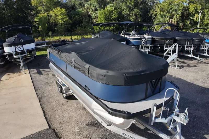 Slide: The Image of 2026 Viaggio Lago V 20 C pontoon boat with cover on trailer in a lot. - 5