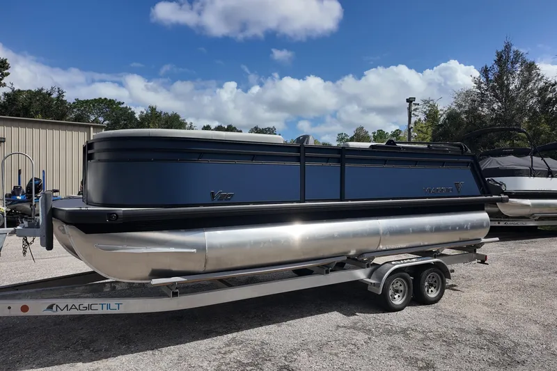 Slide: The Image of 2026 Viaggio Lago V 20 C pontoon boat on trailer under blue sky. - 8