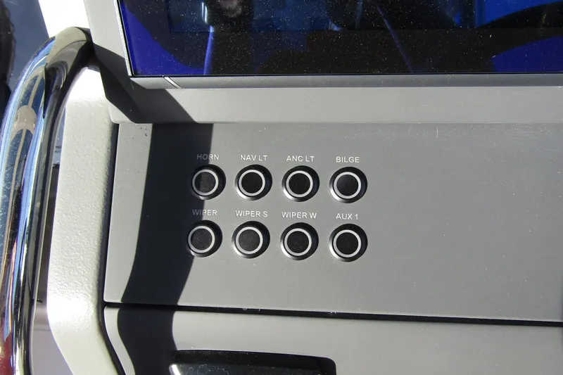Slide: The Image of Control panel of 2025 Nimbus Tender 9 boat with labeled buttons. - 17