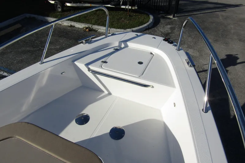 Slide: The Image of 2025 Nimbus Tender 9 boat deck with stainless steel railings and storage compartment. - 9
