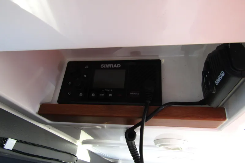 Slide: The Image of Simrad marine radio equipment inside 2025 Nimbus Tender 9 boat. - 21