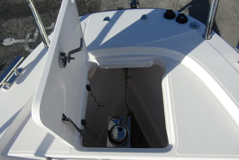 Slide: The Image of Open storage compartment on 2025 Nimbus Tender 9 boat deck. - 10