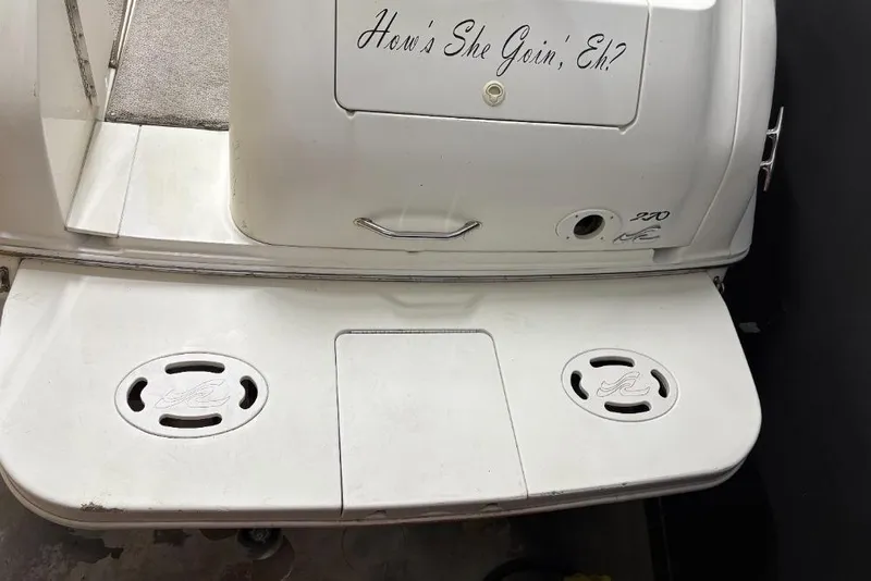 Slide: The Image of 1999 Sea Ray 270 Sundancer boat stern with custom text "How's She Goin', Eh?" - 9