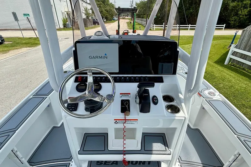 Slide: The Image of 2021 Sea Hunt BX 22 BR boat console with Garmin display and steering wheel. - 11