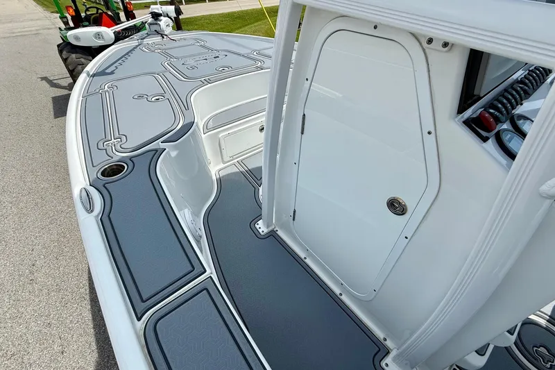 Slide: The Image of 2021 Sea Hunt BX 22 BR boat deck with sleek design and storage compartments. - 13