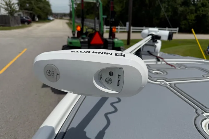 Slide: The Image of Minn Kota Riptide motor on 2021 Sea Hunt BX 22 BR boat, parked on a street. - 20