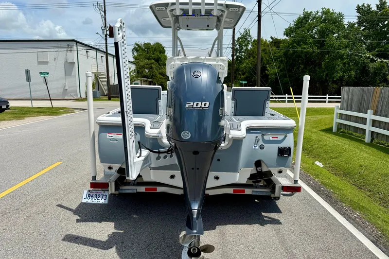 Slide: The Image of 2021 Sea Hunt BX 22 BR boat with Yamaha 200 engine on a trailer. - 3