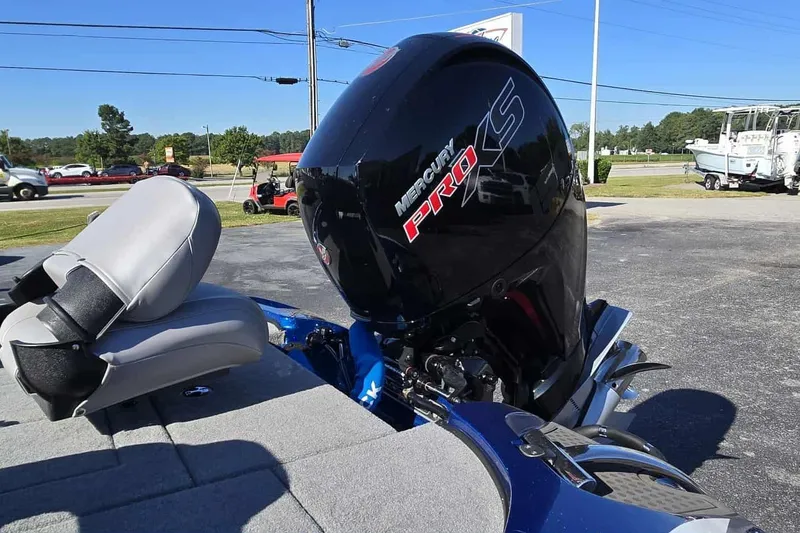 Slide: The Image of 2024 Nitro Z18 boat with Mercury Pro XS engine, parked outdoors. - 14