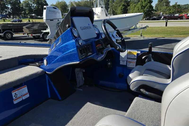 Slide: The Image of 2024 Nitro Z18 boat interior with Garmin navigation system and comfortable seating. - 9