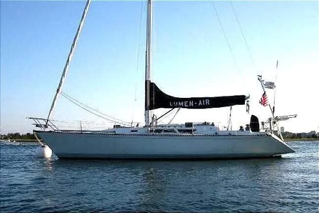 Slide: The Image of 1988 C&C 44 sailboat "Lumen-Air" on calm water, side view. - 3