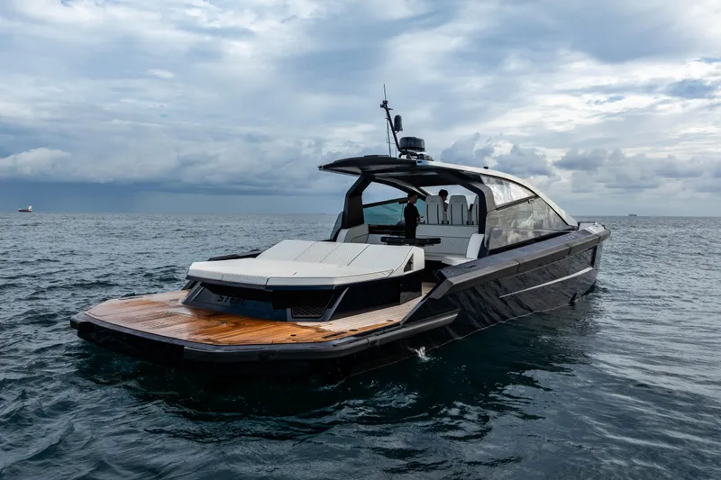 Slide: The Image of Luxury Maori 54 yacht cruising on open sea under cloudy sky, 2023 model. - 17