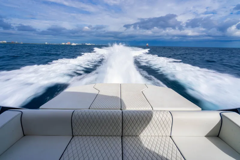 Slide: The Image of Luxury Maori 54 yacht cruising on open sea, leaving a foamy wake behind. - 18
