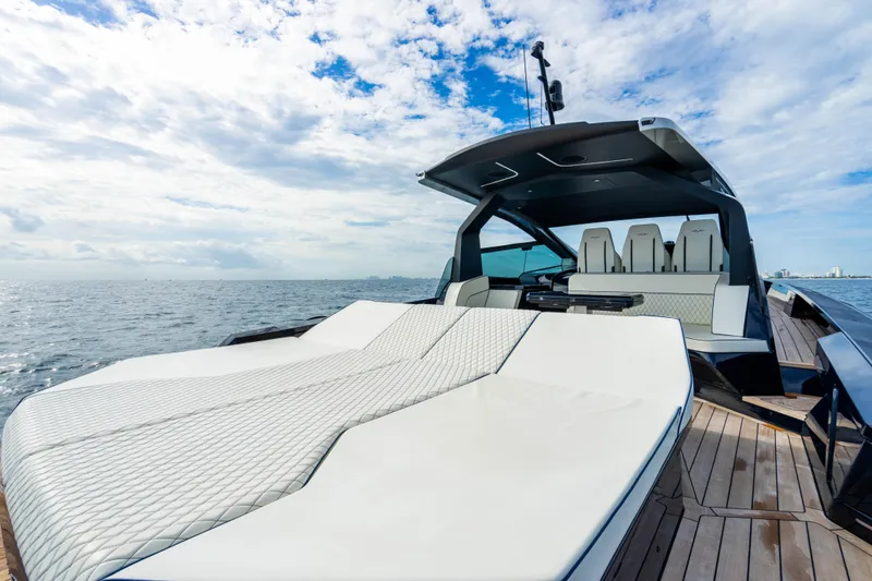 Slide: The Image of Luxurious 2023 Maori 54 yacht with spacious deck and modern seating on open water. - 23