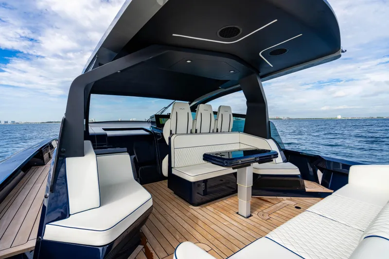 Slide: The Image of Luxurious 2023 Maori 54 yacht interior with modern seating and ocean view. - 24