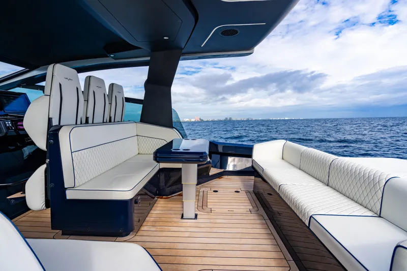 Slide: The Image of Luxurious 2023 Maori 54 yacht interior with elegant seating and ocean view. - 25