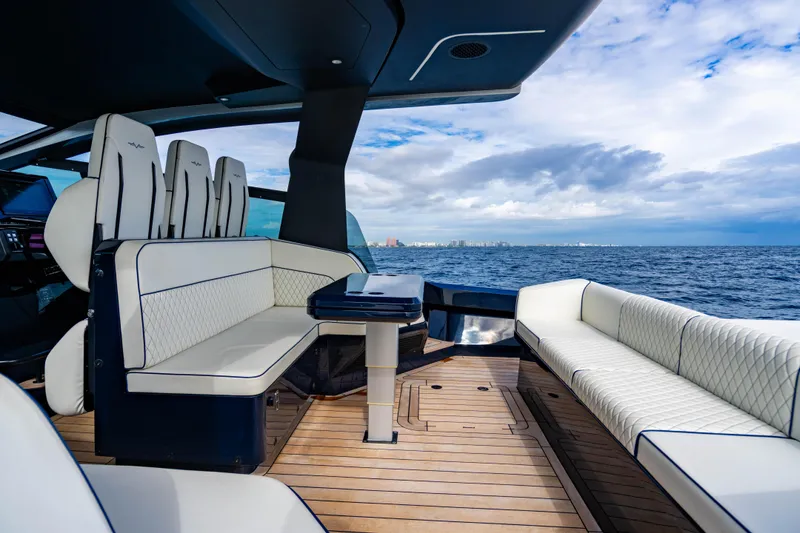 Slide: The Image of Luxurious 2023 Maori 54 yacht interior with elegant seating and ocean view. - 26