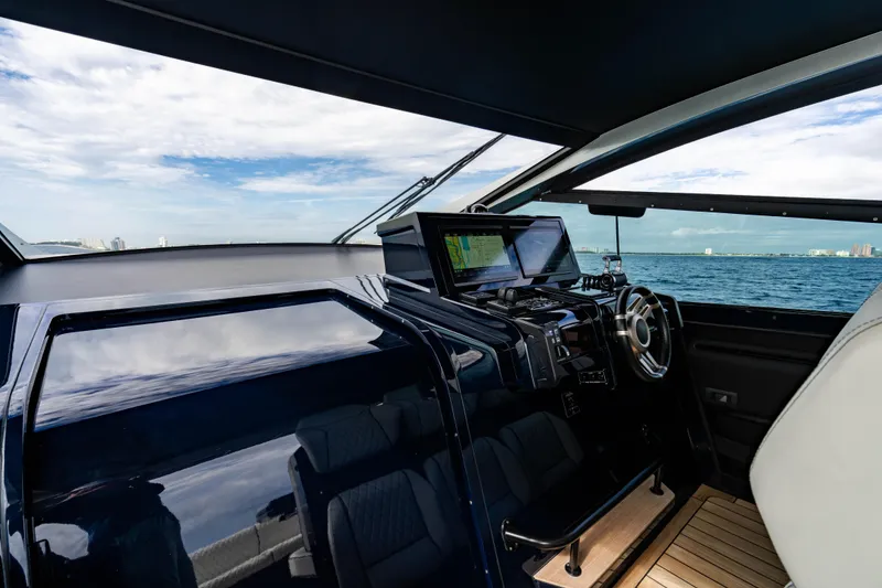 Slide: The Image of Interior view of 2023 Maori 54 yacht cockpit with ocean backdrop. - 27