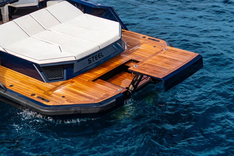 Slide: The Image of Luxury Maori 54 yacht with wooden deck and sunbed, 2023 model, on blue ocean water. - 28