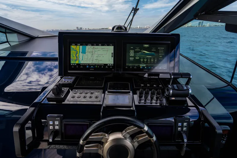 Slide: The Image of Helm of 2023 Maori 54 yacht with advanced navigation displays and controls. - 31