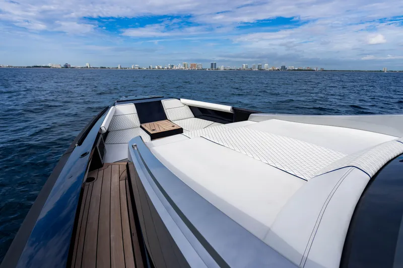 Slide: The Image of Luxury Maori 54 yacht deck with city skyline in the background, 2023 model. - 37