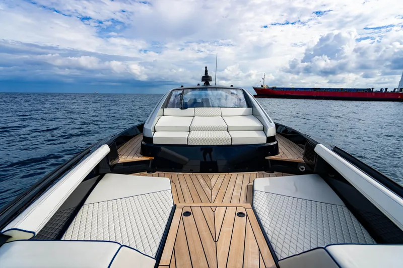 Slide: The Image of Luxury Maori 54 yacht with elegant seating and wooden deck, 2023 model, on open sea. - 38