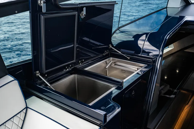 Slide: The Image of Luxury yacht interior with open storage compartments, Maori 54 model, 2023. - 41