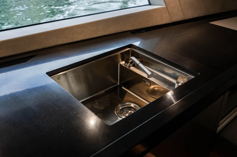 Slide: The Image of Modern stainless steel sink on Maori 54 yacht, 2023 model, with sleek countertop design. - 48