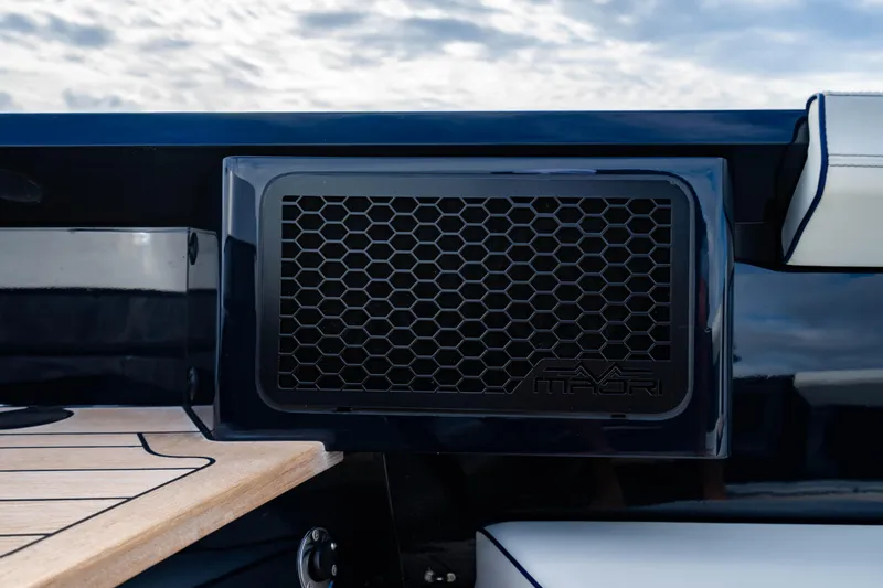 Slide: The Image of Maori 54 yacht detail, 2023 model, featuring sleek design and honeycomb vent. - 50