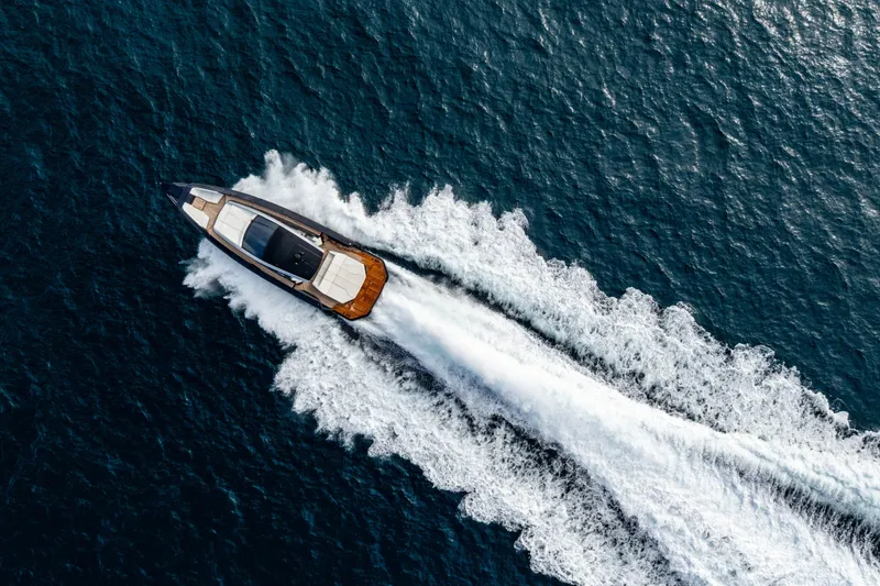 Slide: The Image of Aerial view of 2023 Maori 54 yacht cruising on open sea. - 52