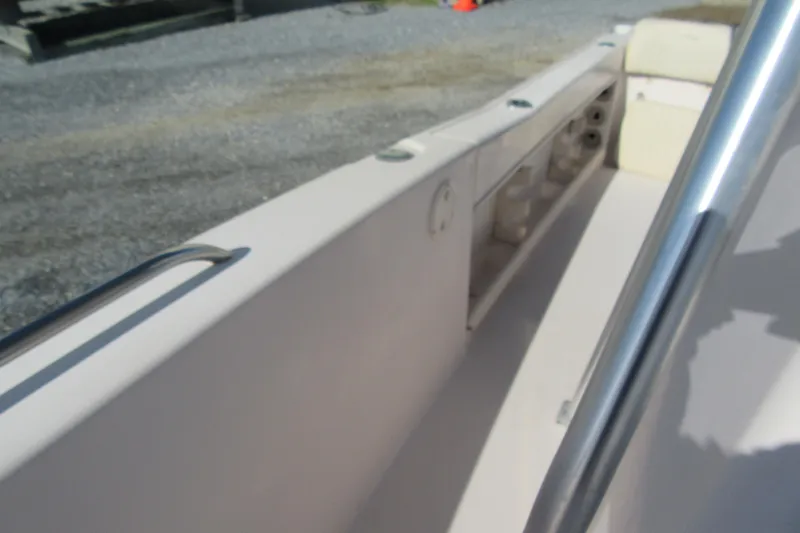 Slide: The Image of 2004 Grady-White Fisherman 222 boat interior with seating and storage compartments. - 10