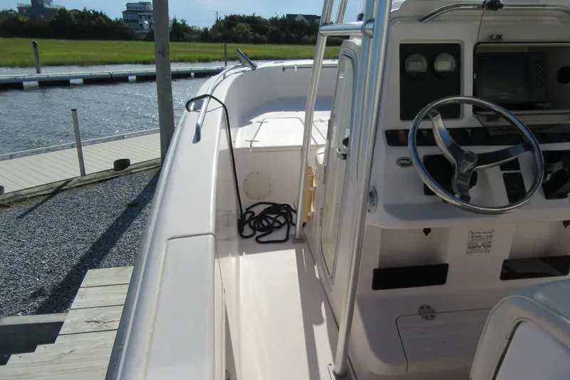 Slide: The Image of 2004 Grady-White Fisherman 222 boat interior with steering wheel and control panel. - 6