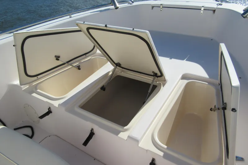 Slide: The Image of 2004 Grady-White Fisherman 222 boat storage compartments open on deck. - 9