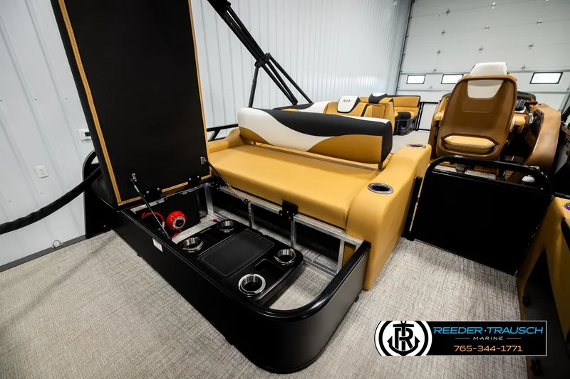 Slide: The Image of 2026 Avalon LSZ VRB boat interior with tan seating and storage compartments. - 28